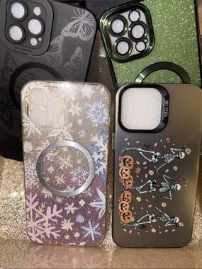 6 iPhone 12 Pro Max Cases. 2 glitter ones, Halloween and 3 Butterfly.